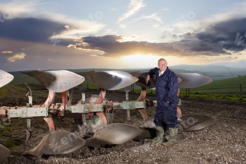 Preview: Farmer Leaning Against Plough In Field