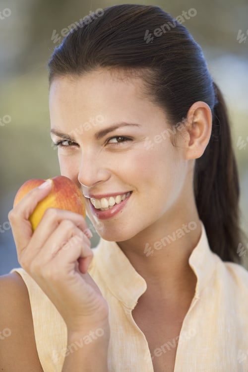 Preview: A Woman Eating A Peach