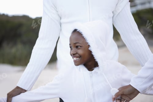 Preview: Two Generation Family In White Clothing Standing On Beach, Focus On Girl (8-10), Smiling