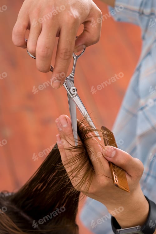Preview: Man Cutting Hair With Scissors And Comb In Hairdressing Salon
