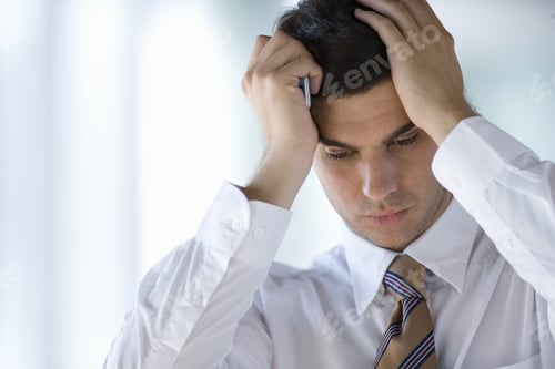 Preview: Frustrated Businessman Holding Cell Phone