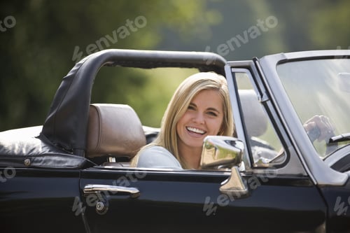 Preview: A Young Woman Driving A Black Sports Car