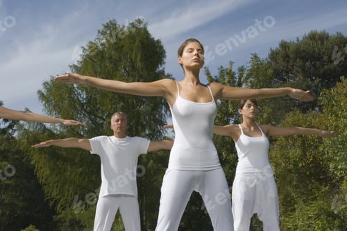 Preview: Two Young Women And A Mature Man Exercising In A Park