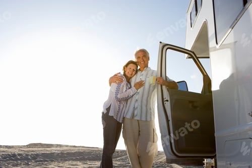 Preview: Mature Couple Relaxing On Motor Home Vacation At Beach At Camera