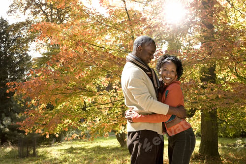 Preview: African Couple Hugging In Park In Autumn