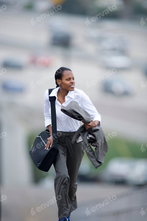 Preview: Busy Businesswoman Running Outdoors Late For City Meeting