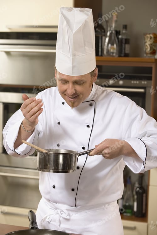 Preview: A Chef Cooking In A Kitchen.