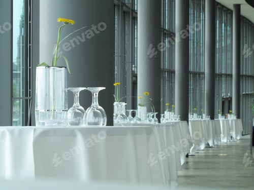 Preview: Tables Set With Glasses And Vases Inside Modern Restaurant Area