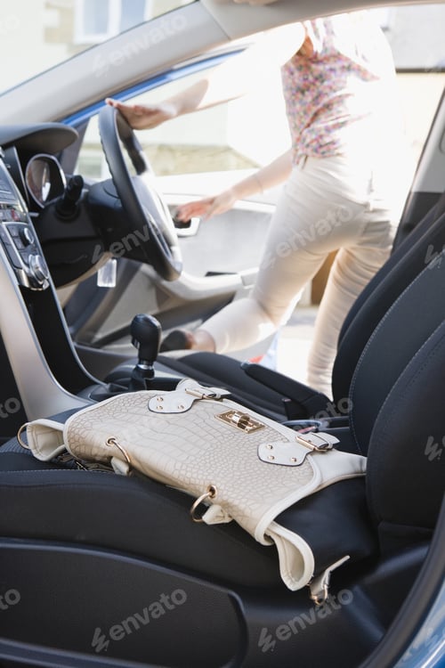 Preview: Female Driver Leaving Handbag In Car As She Gets Out