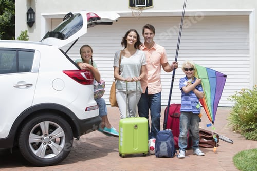 Preview: Portrait Of Smiling Family Packing Car In Sunny Driveway