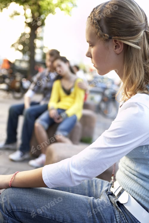 Preview: A Young Couple Sitting, A Teenage Girl Sitting Alone.