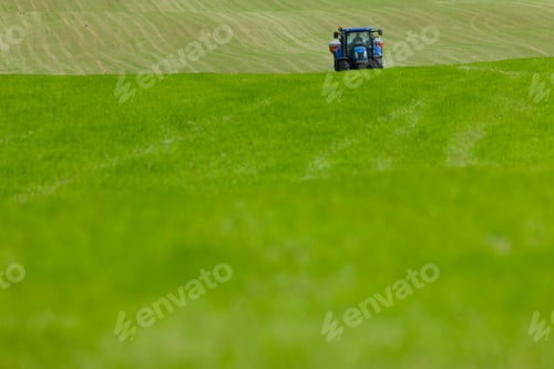Preview: Tractor Spreading Fertilizer In Field