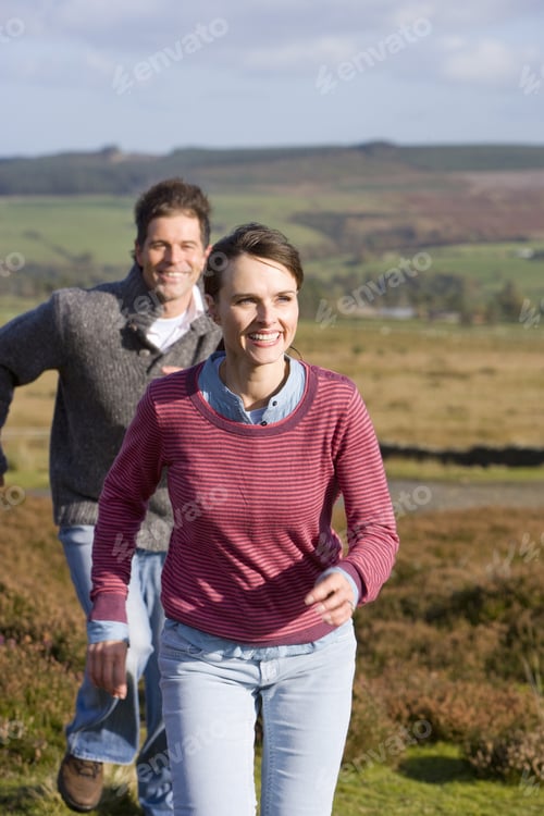Preview: Happy Couple Running Through Countryside