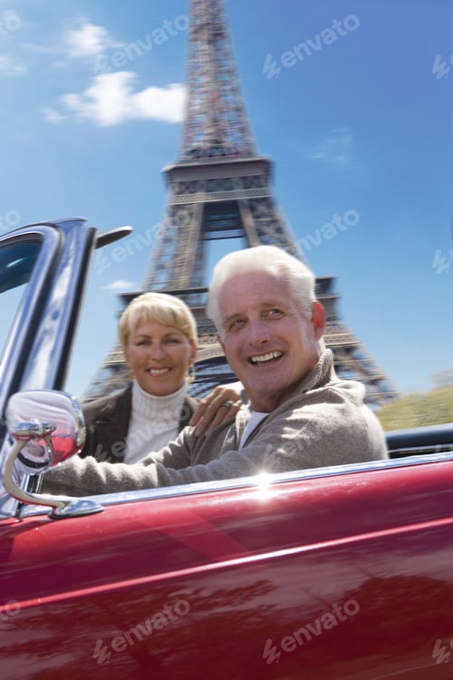 Preview: Senior Couple In Convertible Driving By Eiffel Tower Replica