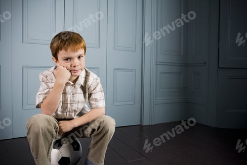 Preview: Little Boy Sitting On His Football