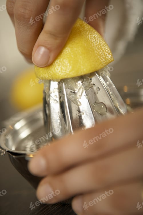 Preview: Close-Up Of A Woman'S Hand Squeezing A Lemon