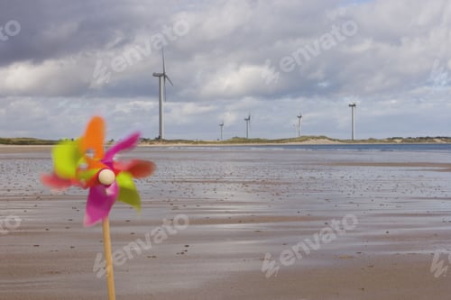 Preview: Windmills And Pinwheel On Shore