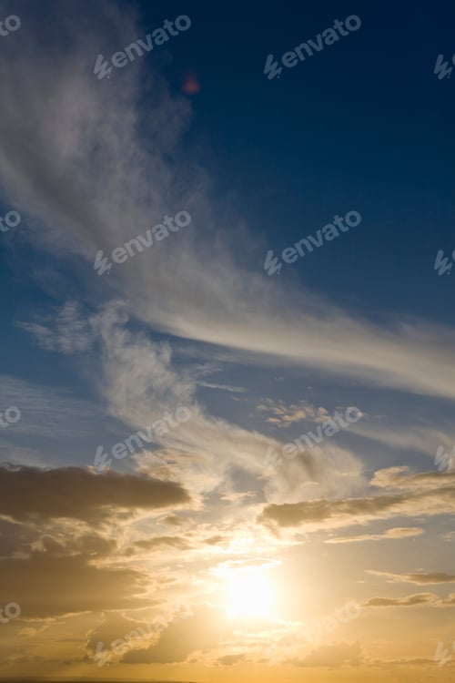 Preview: Dramatic Beautiful Sunset With Sun Setting In Blue Sky With Clouds