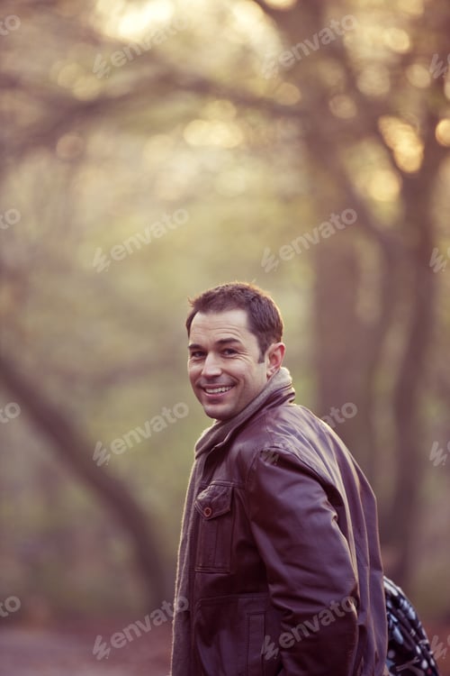 Preview: A Young Father Pushing A Stroller In The Park