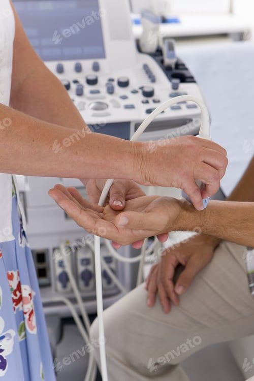 Preview: Technician Using Ultrasound Treatment On Patientã¢Â?Â?S Wrist