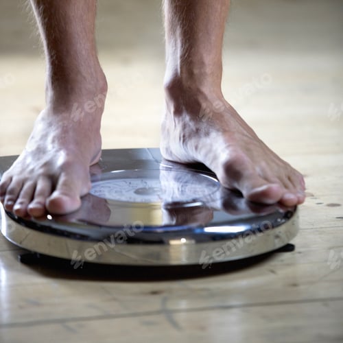 Preview: A Young Man Standing On Scales