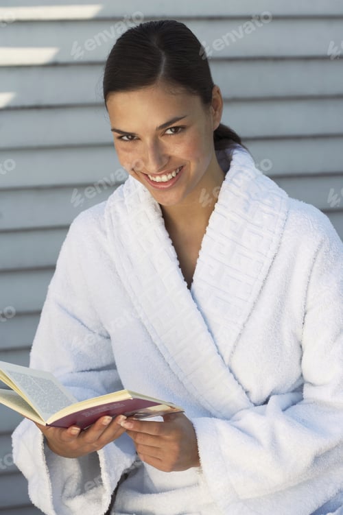 Preview: Woman Wearing A Bathrobe Reading.
