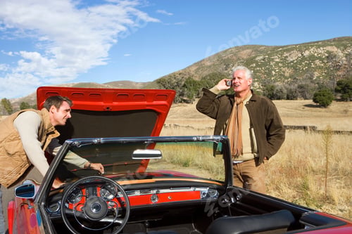 Preview: Father And Adult Son Breakdown With Classic Car Using Mobile Phone