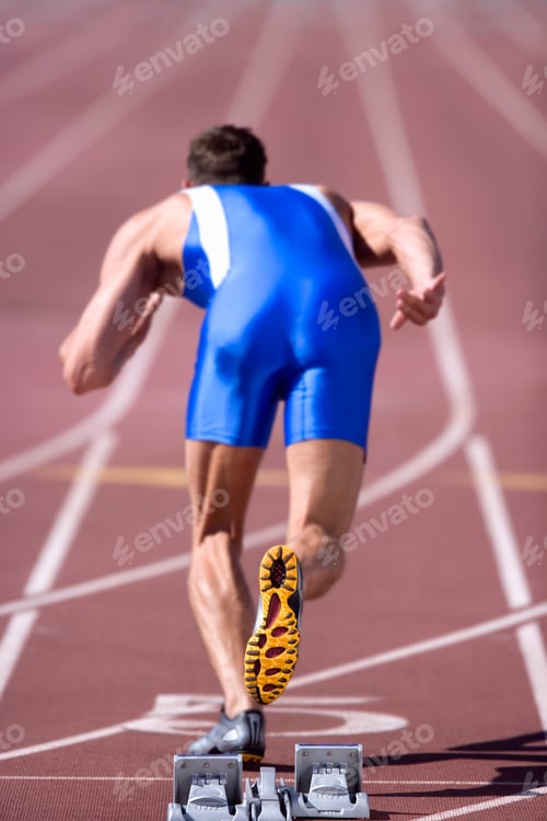 Preview: Competitive Male Athlete Leaves Starting Blocks In Sprint Running Race