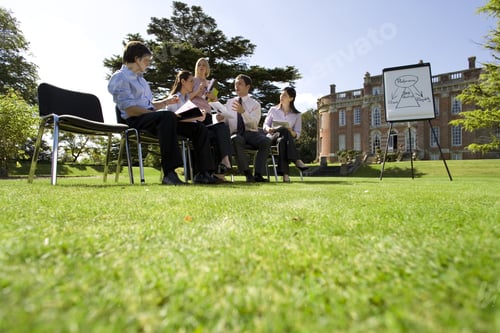 Preview: Businessmen And Women With Folders In Training Course By Manor House, Ground View