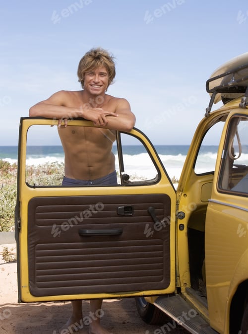 Preview: A Young Man Leaning On The Door Of A Car