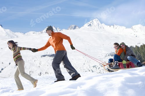 Preview: Family Pulling Sled In The Snow