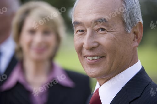 Preview: Businessman Smiling By Colleague, Close-Up