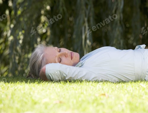 Preview: A Senior Woman Asleep In The Garden
