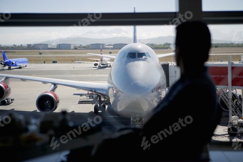Preview: Man In Airport Watching Airplanes On Tarmac