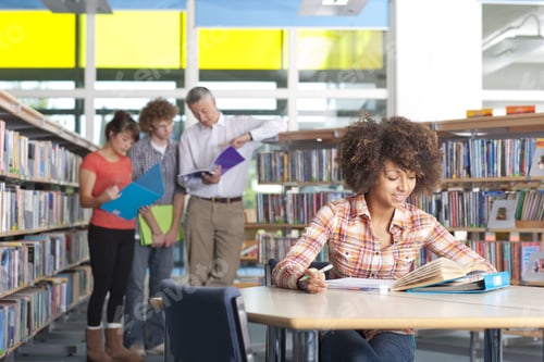 Preview: Smiling Student Studying In School Library