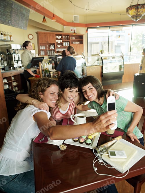 Preview: Group Of Girlfriends Sitting At Cafe Table Taking Selfie Mobile Phone