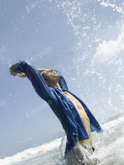Preview: A Man Splashing Water In The Sea