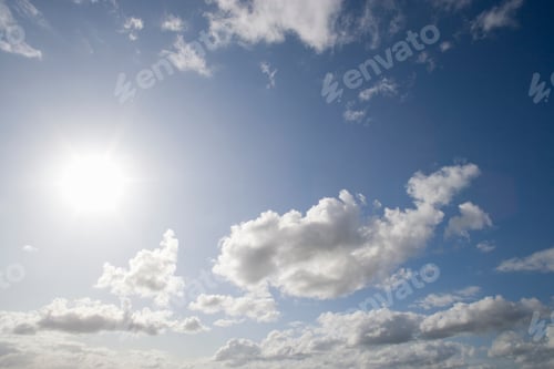 Preview: White Fluffy Cumulus Clouds Against Blue Summer Sky