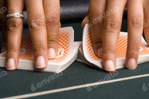 Preview: Female Croupier Shuffling Cards On Gambling Table, Close-Up Of Hands