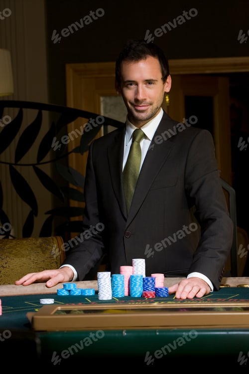 Preview: Portrait Of Man Standing At Casino Table With Gambling Chips