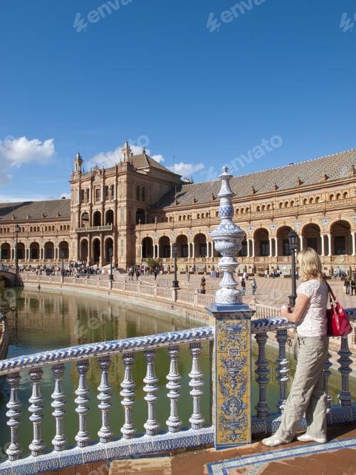 Preview: Tourist Viewing Ornate Building In Plaza De Espana, Seville, Spain