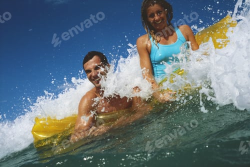 Preview: Mid Adult Couple On An Inflatable Raft In The Sea