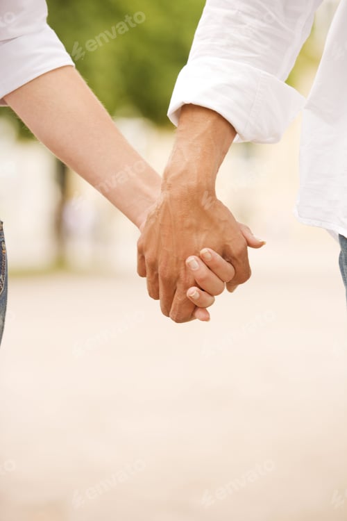 Preview: Close-Up Of A Man And A Woman Holding Each Other'S Hands