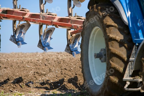 Preview: Detail Of Tractor And Plough Working In Farm Field