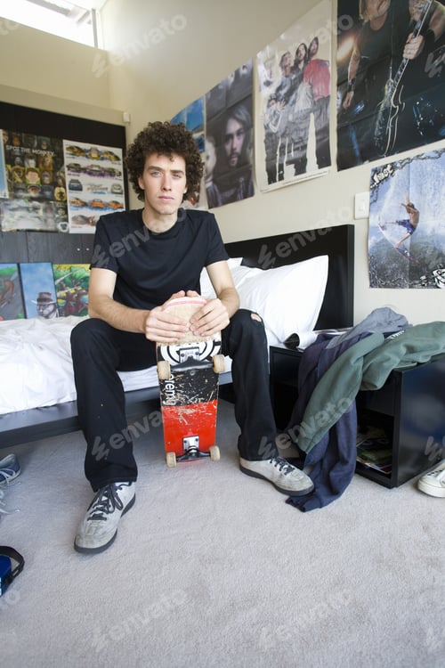 Preview: Teenage Boy (16-18) Sitting In Bedroom With Skateboard, Portrait