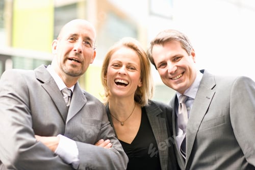 Preview: Portrait Of Laughing Businessmen And Businesswoman Outdoors