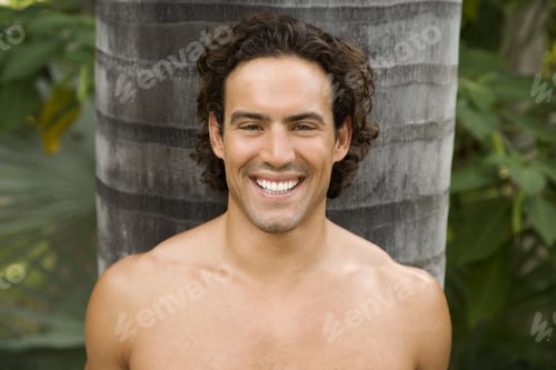 Preview: Portrait Of A Toned Muscular Man Standing In A Garden