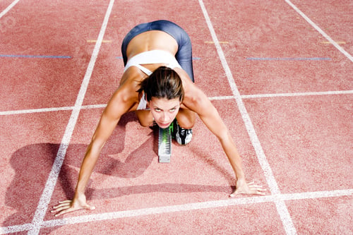 Preview: Female Athlete In The Starting Blocks