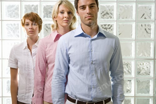 Preview: Three Professionals Standing in Front of Glass Blocks