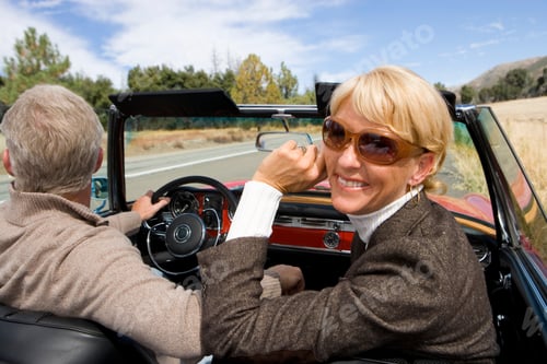 Preview: Mature Couple On Road Trip In Classic Convertible Car On Country Road